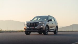 Mahindra XUV700 2026 front three quarter view on Indian highway at sunrise showing premium design and road presence